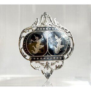 Elegant Silver and Black Brooch